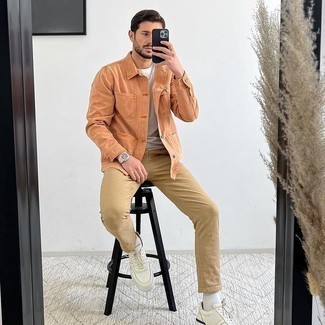White and Navy Leather Low Top Sneakers Outfits For Men: Wear an orange shirt jacket and khaki chinos if you wish to look dapper without too much work. Take an otherwise mostly dressed-up ensemble a more relaxed path with white and navy leather low top sneakers.