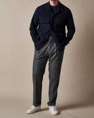 Navy Wool Shirt Jacket Outfits For Men: This pairing of a navy wool shirt jacket and charcoal wool dress pants is a fail-safe option when you need to look like a visionary in the menswear department. Feeling inventive? Spice things up with white canvas low top sneakers.
