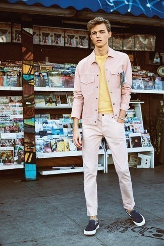 Hot Pink Corduroy Shirt Jacket Outfits For Men: A hot pink corduroy shirt jacket and pink jeans? It's an easy-to-achieve ensemble that you could work on a day-to-day basis. A pair of navy canvas slip-on sneakers acts as the glue that ties this ensemble together.
