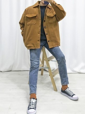Blue Canvas Low Top Sneakers Outfits For Men: A tan shirt jacket and blue jeans will inject extra style into your current casual routine. Let your outfit coordination chops truly shine by rounding off this ensemble with blue canvas low top sneakers.