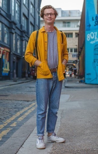 Yellow Shirt Jacket Outfits For Men: One of the best ways for a man to style a yellow shirt jacket is to team it with light blue jeans for a casual ensemble. Finish off with white leather low top sneakers to transform your getup.