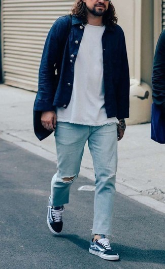 Navy Shirt Jacket Outfits For Men: Pair a navy shirt jacket with light blue ripped jeans to feel absolutely confident in yourself and look neat and relaxed. Let your expert styling truly shine by rounding off your ensemble with a pair of navy and white canvas low top sneakers.
