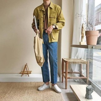 Tan Canvas Tote Bag Outfits For Men: This off-duty pairing of a mustard shirt jacket and a tan canvas tote bag is a tested option when you need to look stylish in a flash. Balance your ensemble with a dressier kind of shoes, such as this pair of white canvas slip-on sneakers.