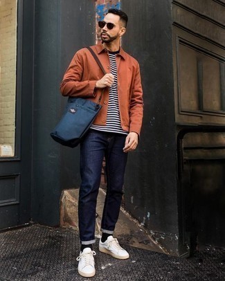 Mustard Shirt Jacket Outfits For Men: Wear a mustard shirt jacket with navy jeans to achieve a cool and casual ensemble. Complete your getup with a pair of white canvas low top sneakers to effortlessly amp up the street cred of your look.