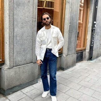 White Shirt Jacket Outfits For Men: A white shirt jacket and blue jeans? This is an easy-to-create ensemble that anyone could wear a variation of on a day-to-day basis. Finishing off with white athletic shoes is a guaranteed way to infuse a more laid-back finish into this getup.
