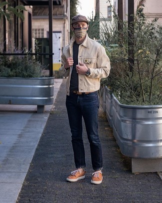 Beige Corduroy Shirt Jacket Outfits For Men: This casual combination of a beige corduroy shirt jacket and navy jeans can only be described as devastatingly sharp. Feeling creative today? Mix things up a bit by finishing with tobacco leather low top sneakers.