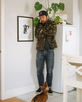 Navy Ripped Jeans Outfits For Men: For a casually dapper ensemble, try teaming an olive camouflage shirt jacket with navy ripped jeans — these pieces play beautifully together. Black and white canvas low top sneakers are an effortless way to infuse an extra dose of style into your ensemble.