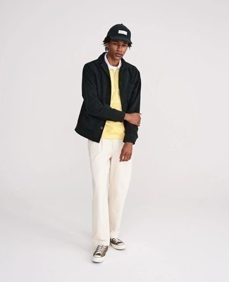Black Shirt Jacket Outfits For Men: Such items as a black shirt jacket and white chinos are an easy way to infuse some masculine elegance into your daily wardrobe. Olive canvas low top sneakers are a simple way to punch up your ensemble.