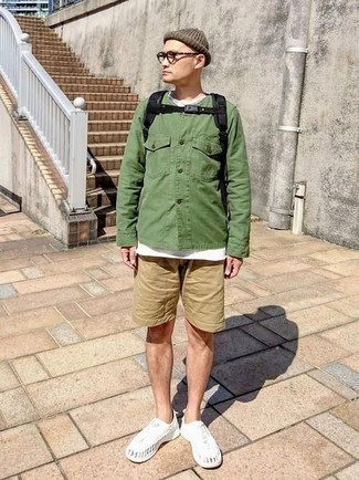 Black Canvas Backpack Outfits For Men: You'll be amazed at how super easy it is for any gentleman to pull together a bold casual outfit like this. Just a green shirt jacket and a black canvas backpack. White athletic shoes integrate well within many looks.