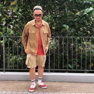 White and Red Canvas Low Top Sneakers Outfits For Men: Opt for a tan shirt jacket and beige shorts for a casual level of dress. A pair of white and red canvas low top sneakers adds just the right amount of visual interest to this ensemble.