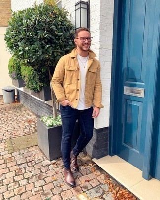 Navy Skinny Jeans Smart Casual Outfits For Men: Extremely dapper, this relaxed pairing of a tan shirt jacket and navy skinny jeans provides wonderful styling opportunities. Complement this ensemble with brown leather chelsea boots to immediately kick up the style factor of this outfit.