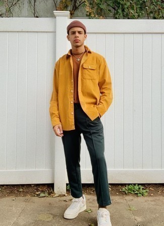 Orange Shirt Jacket Outfits For Men: Pair an orange shirt jacket with dark green sweatpants for a comfy menswear style that's also put together. Let your styling skills really shine by finishing your look with white leather low top sneakers.