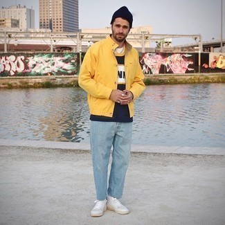 Yellow Shirt Jacket Outfits For Men: Consider pairing a yellow shirt jacket with light blue jeans for a casual and cool and trendy look. And if you need to instantly play down this outfit with a pair of shoes, why not introduce white leather low top sneakers to this outfit?