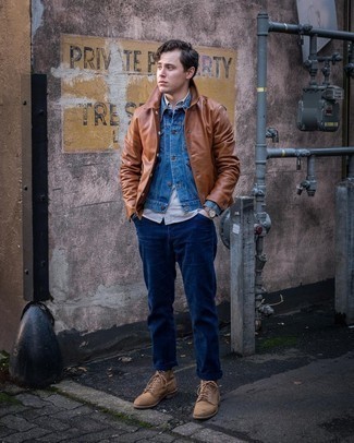 Blue Denim Jacket Outfits For Men: For comfort dressing with a modern spin, marry a blue denim jacket with navy jeans. Want to play it up in the footwear department? Add a pair of tan leather casual boots to this getup.