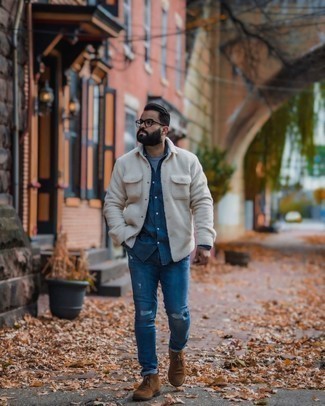 Navy Ripped Jeans Outfits For Men: Opt for a beige fleece shirt jacket and navy ripped jeans for a hassle-free getup that's also put together. If you need to easily kick up this look with footwear, complement your look with dark brown suede desert boots.