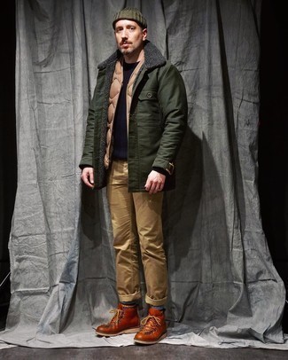Work Boots Outfits For Men: A dark green shirt jacket and khaki chinos matched together are a perfect match. And if you need to immediately dial down your look with footwear, add work boots to your outfit.