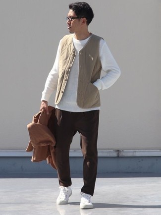 White Crew-neck Sweater Outfits For Men: Go for a pared down yet laid-back and cool choice by opting for a white crew-neck sweater and dark brown chinos. For a more relaxed finish, complete your look with white canvas high top sneakers.