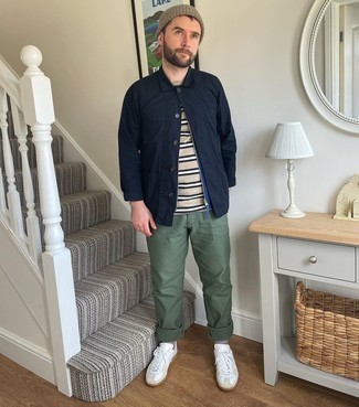 White Leather Low Top Sneakers Outfits For Men: For a casually neat outfit, try pairing a navy shirt jacket with olive chinos — these items go well together. White leather low top sneakers add a little edge to this ensemble.