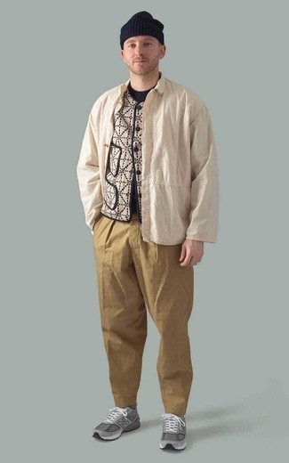 Beige Shirt Jacket Outfits For Men: This combo of a beige shirt jacket and khaki chinos looks sharp, but it's extremely easy to throw together. Complete this outfit with a pair of grey athletic shoes to serve a little outfit-mixing magic.