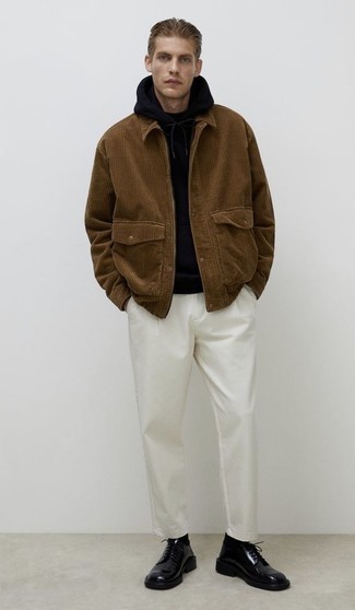 Brown Corduroy Shirt Jacket Outfits For Men: Team a brown corduroy shirt jacket with white chinos to don a dressy, but not too dressy ensemble. For a modern on and off-duty mix, add black chunky leather derby shoes to your outfit.