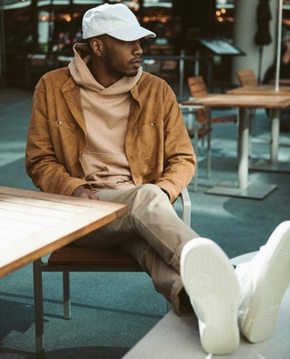 Beige Hoodie Outfits For Men: To don a relaxed menswear style with a modern spin, wear a beige hoodie and beige chinos. White leather low top sneakers look right at home with this ensemble.