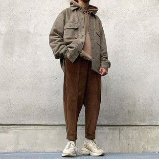 Tan Hoodie Outfits For Men: Wear a tan hoodie with dark brown corduroy chinos to achieve a laid-back and cool outfit. For something more on the daring side to complement your look, add beige athletic shoes to the mix.