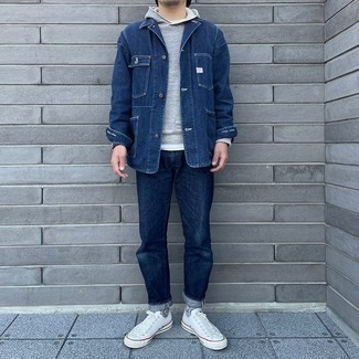Navy Jacket Outfits For Men: Uber stylish and practical, this casual combo of a navy jacket and navy jeans provides with variety. White canvas low top sneakers will pull this full ensemble together.