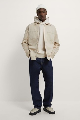 Beige Hoodie Outfits For Men: Reach for a beige hoodie and navy jeans for both on-trend and easy-to-style look. Beige canvas low top sneakers are a welcome complement for this outfit.