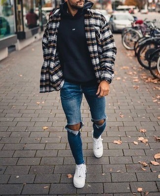 Navy Hoodie Outfits For Men: Such pieces as a navy hoodie and navy ripped skinny jeans are an easy way to introduce effortless cool into your current off-duty collection. Complete this outfit with white leather low top sneakers to spice things up.
