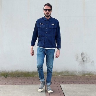 Grey Canvas High Top Sneakers Outfits For Men: Wear a navy shirt jacket with blue jeans for relaxed dressing with a modern spin. Not sure how to finish? Complement this ensemble with a pair of grey canvas high top sneakers to switch things up.