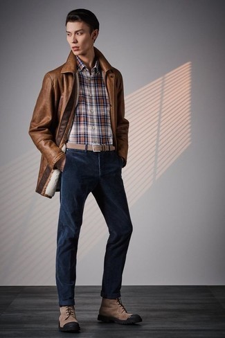 500+ Fall Outfits For Men: A brown leather shirt jacket and navy corduroy chinos are fitting for both semi-casual occasions and casual wear. Our favorite of a ton of ways to round off this ensemble is brown canvas casual boots. Can you see how extremely easy it is to look dapper and stay comfortable when cooler weather comes, thanks to this getup?
