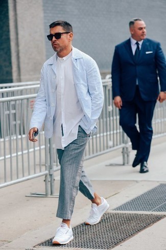 Light Blue Shirt Jacket Outfits For Men: For a relaxed casual menswear style with a contemporary spin, consider wearing a light blue shirt jacket and grey vertical striped chinos. You could perhaps get a bit experimental with footwear and introduce a pair of white athletic shoes to your look.