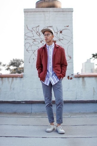 Red Shirt Jacket Outfits For Men: This pairing of a red shirt jacket and light blue chinos is a mix between dressy and laid-back. Play down your ensemble by rounding off with white canvas low top sneakers.