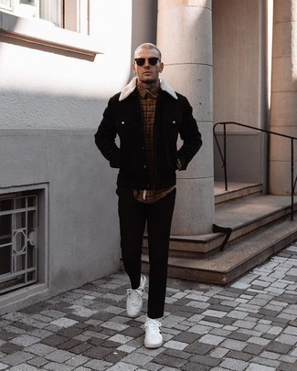 Black Suede Shirt Jacket Outfits For Men: Channel your inner menswear guru and team a black suede shirt jacket with black chinos. Complete your getup with a pair of white and black leather low top sneakers to bring a dose of stylish nonchalance to this outfit.