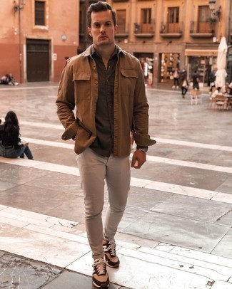 Beige Chinos Outfits: Channel your inner expert in modern men's fashion and try teaming a brown shirt jacket with beige chinos. Round off your look with a pair of tan athletic shoes to change things up a bit.