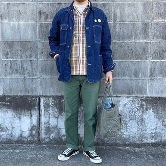 Men's Outfits 2021: For an ensemble that's worthy of a modern style-savvy guy and casually sleek, consider teaming a navy denim shirt jacket with dark green chinos. A pair of black and white canvas low top sneakers can easily dress down an all-too-polished outfit.