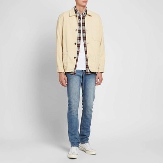 Beige Shirt Jacket Outfits For Men: This relaxed casual combo of a beige shirt jacket and blue jeans is a surefire option when you need to look casual and cool but have zero time to dress up. Finish with white canvas low top sneakers to instantly dial up the appeal of your outfit.