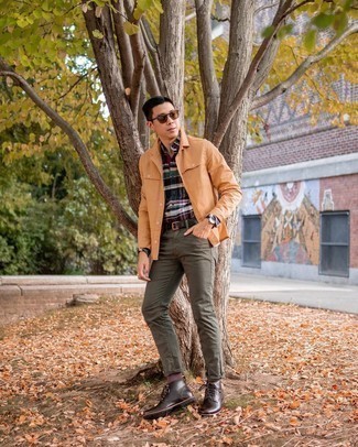 Olive Jeans Outfits For Men: A tan shirt jacket and olive jeans are a pairing that every modern guy should have in his menswear collection. On the footwear front, this ensemble is completed well with dark brown leather casual boots.