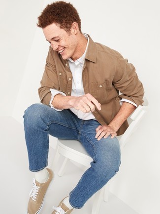 Beige Shirt Jacket Outfits For Men: Reach for a beige shirt jacket and blue jeans to feel absolutely confident in yourself and look fashionable. A pair of tan canvas low top sneakers easily revs up the cool of this look.