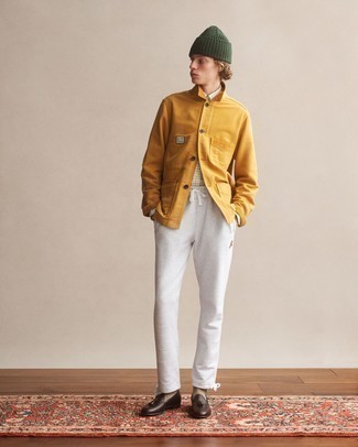 Mustard Shirt Jacket Outfits For Men: For an off-duty look, go for a mustard shirt jacket and grey sweatpants — these pieces play beautifully together. Feeling bold? Elevate your getup by slipping into a pair of dark brown leather tassel loafers.