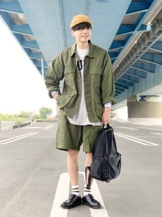 Black Canvas Backpack Outfits For Men: To don a laid-back look with an edgy spin, opt for an olive shirt jacket and a black canvas backpack. Want to go all out on the shoe front? Introduce black leather derby shoes to the equation.