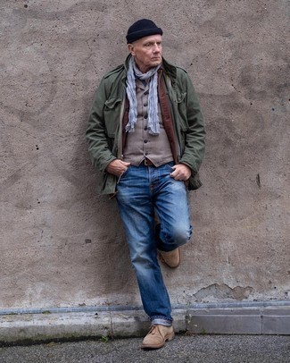 Brown Coat with Jeans Outfits For Men After 50: Reach for a brown coat and jeans for a classic and sophisticated silhouette. A trendy pair of brown suede desert boots is the simplest way to transform your outfit. This combination is perfect for gents in their 50s.
