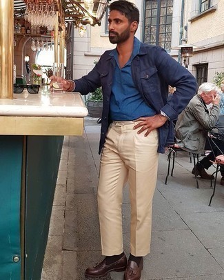 Beige Dress Pants Outfits For Men: Consider wearing a navy shirt jacket and beige dress pants to have all eyes on you. Rock a pair of dark brown leather tassel loafers and ta-da: the ensemble is complete.