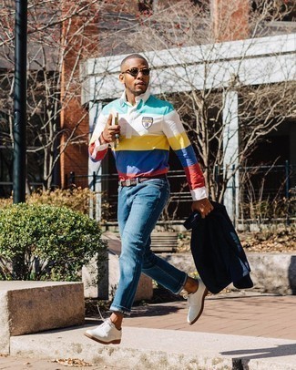 Multi colored Horizontal Striped Polo Neck Sweater Outfits For Men: Choose a multi colored horizontal striped polo neck sweater and blue jeans if you're aiming for a sleek, stylish outfit. For a more polished touch, why not complement your getup with a pair of white suede derby shoes?
