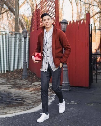 Grey Sweater Vest Outfits For Men: Rock a grey sweater vest with charcoal check chinos to pull together an interesting and put together outfit. Go ahead and add a pair of white canvas low top sneakers to the mix for a touch of stylish nonchalance.