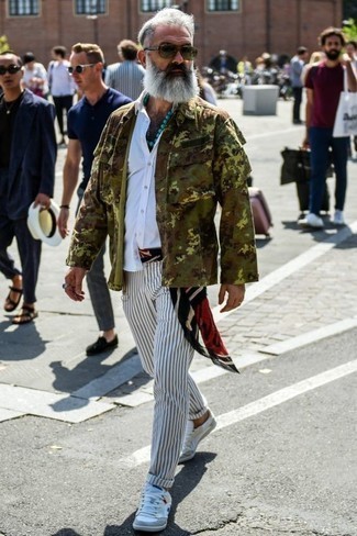 Multi colored Print Scarf Outfits For Men: If you're searching for an edgy but also on-trend ensemble, opt for an olive camouflage shirt jacket and a multi colored print scarf. Put a different spin on your ensemble by sporting white canvas low top sneakers.
