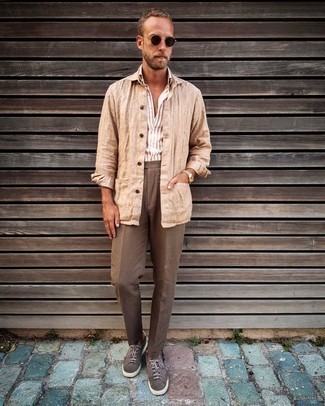 Brown Suede Low Top Sneakers Outfits For Men: This combo of a tan linen shirt jacket and brown chinos is a mix between formal and relaxed casual. For something more on the daring side to round off this look, choose a pair of brown suede low top sneakers.