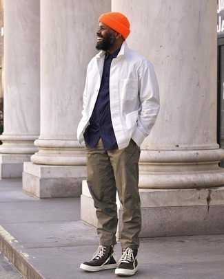 Orange Beanie Outfits For Men: This off-duty pairing of a white lightweight shirt jacket and an orange beanie is a tested option when you need to look dapper but have no time to spare. If you don't know how to round off, a pair of black and white leather high top sneakers is a wonderful idea.