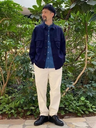 Navy Shirt Jacket Spring Outfits For Men: This combo of a navy shirt jacket and white chinos comes in handy when you need to look casually neat but have no extra time to plan out an outfit. Add black leather derby shoes to the equation to completely jazz up the ensemble. And if you're looking for a cool winter-to-spring outfit, this is it.