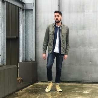 Beige Canvas High Top Sneakers Outfits For Men: An olive shirt jacket and navy jeans are among the key elements in any guy's great casual sartorial collection. Add a pair of beige canvas high top sneakers to this look to keep the outfit fresh.